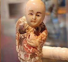 Boy with bag - netsuke